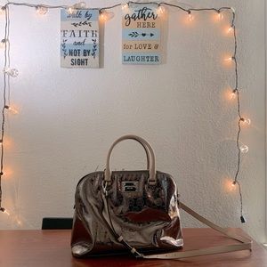 Absolutely gorgeous chrome style MK bag.